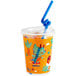 A white plastic kid's cup with a dinosaur print, blue lid, and straw.