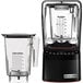 A black Blendtec Stealth X blender with clear containers on top.