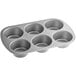 A silver Choice jumbo muffin pan with six compartments.