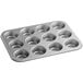 A Choice carbon steel muffin pan with 12 holes.