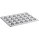 A Choice carbon steel muffin pan with 24 holes.