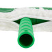 A white and green mop with a green plastic T-bar.