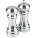 A close-up of two silver Chef Specialties salt and pepper shakers.