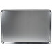 A Carlisle full size aluminum bun/sheet pan on a counter.