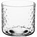 A clear glass Acopa cylindrical votive candle holder with a hobnail pattern.