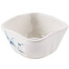 A white square bowl with blue bamboo designs.