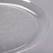 A clear plastic Fineline Savvi Serve plate with swirls on it.