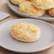 A plate of Gold Medal buttermilk biscuits on a table.