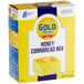 A box of Gold Medal Honey Cornbread Mix on a kitchen counter.