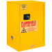A yellow Durham Mfg flammable storage cabinet with a sign on it.