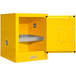 A yellow steel flammable storage cabinet with a manual door open.