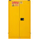 A yellow Durham Mfg safety cabinet with a black and yellow self-closing door and lock.