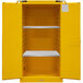 A yellow metal Durham Manufacturing safety cabinet with shelves.