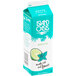 A white and blue carton of Island Oasis Mojito Frozen Beverage Mix with a lime slice and leaf.