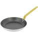 A de Buyer aluminum frying pan with a yellow handle.