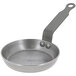 A de Buyer carbon steel egg and pancake pan with a handle.