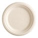 A close-up of an EcoChoice Natural Bagasse Blend Plate with a round edge.