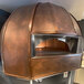 A Wood Stone Traditional Series stone hearth oven with a dome-shaped top.