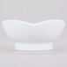 A white melamine bowl with a scalloped edge.