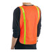 An orange Lavex safety vest with reflective stripes on a person.