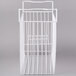 A white wire basket for an Excellence commercial freezer.