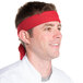 A man wearing a red Intedge chef neckerchief.