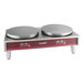 A red and white Estella double crepe maker on a counter with two pans.