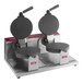 A Estella double waffle cone maker on a counter with two round waffles.