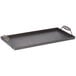 A rectangular black steel griddle tray with handles.