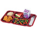 A red Cambro compartment tray with food including chicken nuggets, salad, and rice.