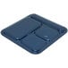 A dark blue Carlisle melamine tray with four square compartments.