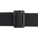 A close-up of a black fabric belt with a metal buckle.