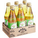 A group of Rose's Sweetened Lime Juice bottles in a cardboard box.