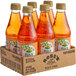 A group of Rose's Peach Syrup bottles in a cardboard box.