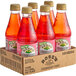 A group of Rose's Strawberry Syrup bottles in a cardboard box.
