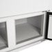 A white Turbo Air ice cream dipping cabinet with curved glass windows.