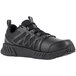 A Reebok Work black athletic shoe for men with laces.
