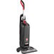 A Hoover Task Vac 2 commercial bagged upright vacuum cleaner on wheels.