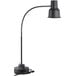 An Avantco black countertop heat lamp with a curved pole and black base.