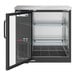 An Avantco black back bar refrigerator with glass doors and shelves.