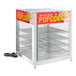 A ServIt countertop display warmer for popcorn with 4 wire shelves.