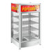 A white ServIt countertop display warmer with 4 shelves for popcorn.