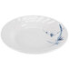 A white Thunder Group melamine plate with a blue bamboo design on the rim.
