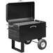 A black rectangular Meadow Creek BBQ42 Chicken Cooker barbecue pit with a metal grate and wheels.