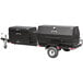 A black trailer with a Meadow Creek Caterer's Delight charcoal barbecue grill on it.