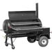 A black Meadow Creek TS120P barbecue smoker on wheels.