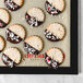 A de Buyer silicone baking mat with a chocolate and peppermint covered shortbread cookie.