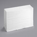 A stack of Tork white multi-fold paper towels.