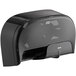A black Tork double roll toilet paper dispenser with a black handle.