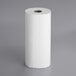 A white box of Tork Universal jumbo paper towel rolls with a hole in the front.